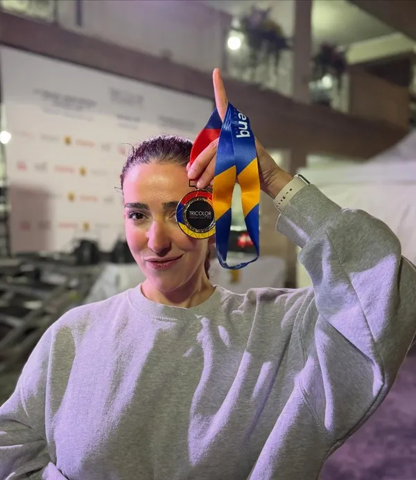 Asdghig holding up a Yerevan Night Run medal after the race