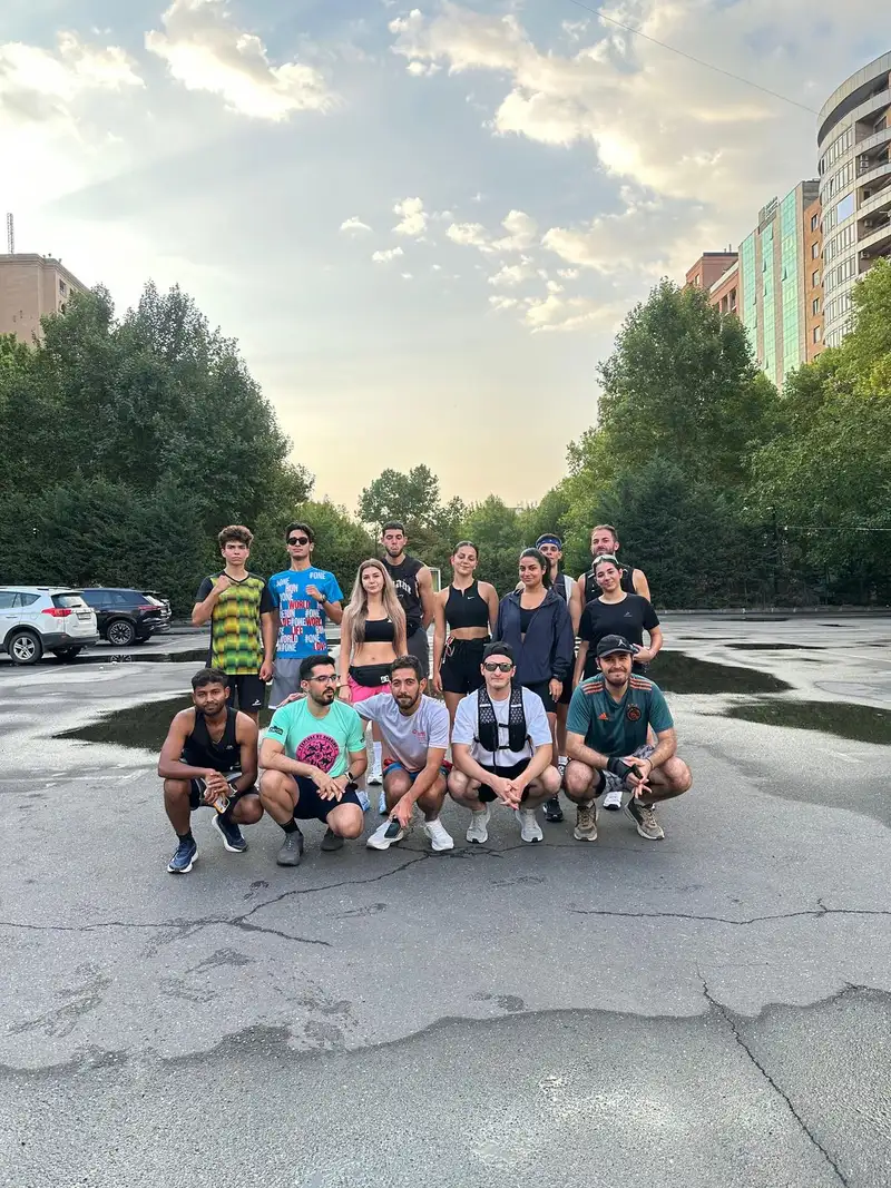Group photo on a park road under an early morning sky