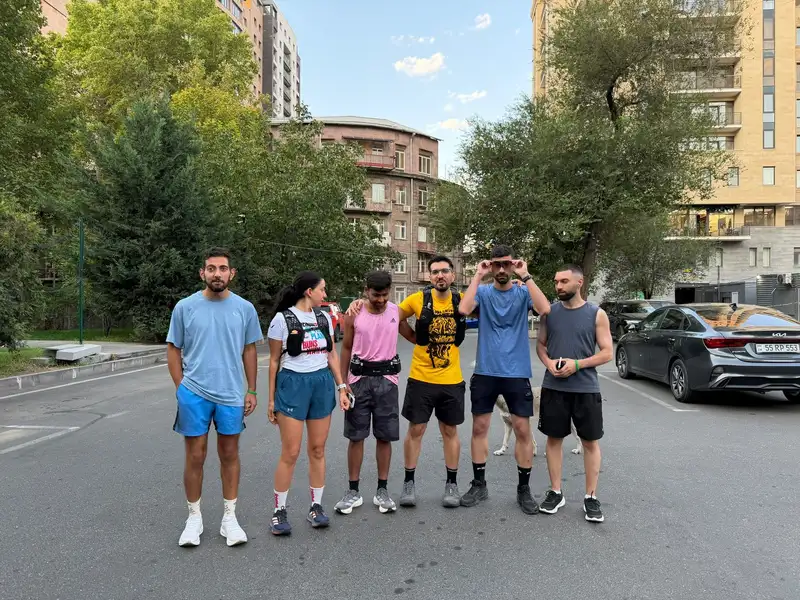 A small group on a quiet residential street after a morning run