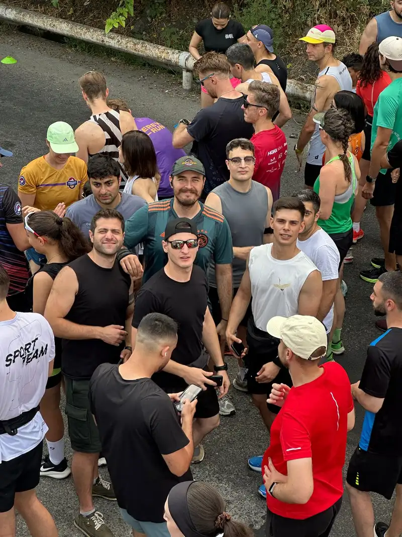 A dense crowd of runners waiting at a race start